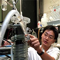 David Kilper / WUSTL Photo<br/>
Jason He inspects their microbial fuel cell. <br/>