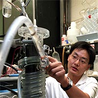 David Kilper / WUSTL Photo<br/>
Jason He inspects their microbial fuel cell. <br/>