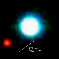 ESO PR Photo 26a/04 is a composite image of the brown dwarf object 2M1207 (centre) and the fainter object seen near it, at an angular distance of 778 milliarcsec. Designated 'Giant Planet Candidate Companion' by the discoverers, it may represent the first image of an exoplanet. Further observations, in particular of its motion in the sky relative to 2M1207 are needed to ascertain its true nature. The photo is based on three near-infrared exposures (in the H, K and L' wavebands) with the NACO adaptive-optics facility at the 8.2-m VLT Yepun telescope at the ESO Paranal Observatory. 
<P>
Image courtesy: ESO