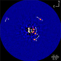 <p>
	Infrared image of the HR8799 planetary system. This image shows planet HR8799b (five times the mass of Jupiter), planets HR8799c and HR8799d (seven times the mass of Jupiter) and the new planet HR8799e. The arrows show the predicted motion of the planets over the next 10 years. The scale bar at the bottom left shows 20 astronomical units (AU), about equal to the radius of the orbit of Uranus.</p>
<p>
	Credit: NRC-HIA, Christian Marois, and the W.M. Keck Observatory</p>
