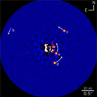 <p>
	Infrared image of the HR8799 planetary system. This image shows planet HR8799b (five times the mass of Jupiter), planets HR8799c and HR8799d (seven times the mass of Jupiter) and the new planet HR8799e. The arrows show the predicted motion of the planets over the next 10 years. The scale bar at the bottom left shows 20 astronomical units (AU), about equal to the radius of the orbit of Uranus.</p>
<p>
	Credit: NRC-HIA, Christian Marois, and the W.M. Keck Observatory</p>
