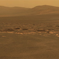 <p>
	A portion of the west rim of Endeavour crater sweeps southward in this color view from NASA's Mars Exploration Rover Opportunity. This crater -- with a diameter of about 14 miles (22 kilometers) -- is more than 25 times wider than any that Opportunity has previously approached during the rover's 90 months on Mars.</p>
<p>
	Image Credit: NASA/JPL-Caltech/Cornell/ASU</p>
