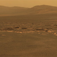 <p>
	A portion of the west rim of Endeavour crater sweeps southward in this color view from NASA's Mars Exploration Rover Opportunity. This crater -- with a diameter of about 14 miles (22 kilometers) -- is more than 25 times wider than any that Opportunity has previously approached during the rover's 90 months on Mars.</p>
<p>
	Image Credit: NASA/JPL-Caltech/Cornell/ASU</p>
