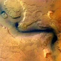 This picture was taken by the High Resolution Stereo Camera (HRSC) onboard ESA's Mars Express orbiter, in colour and 3D, in orbit 18 on 15 January 2004 from a height of 273 km. The location is east of the Hellas basin at 41° South and 101° East. The area is 100 km across, with a resolution of 12 m per pixel, and shows a channel (Reull Vallis) once formed by flowing water. The landscape is seen in a vertical view, North is at the top. 
<P>
Credits: ESA/DLR/FU Berlin (G. Neukum)