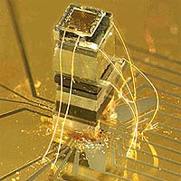 Photo of the NIST chip-scale magnetometer. The sensor is about as tall as a grain of rice. The widest block near the top of the device is an enclosed, transparent cell that holds a vapor of rubidium atoms.
<P>
Photo by Peter Schwindt/NIST