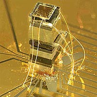 Photo of the NIST chip-scale magnetometer. The sensor is about as tall as a grain of rice. The widest block near the top of the device is an enclosed, transparent cell that holds a vapor of rubidium atoms.
<P>
Photo by Peter Schwindt/NIST