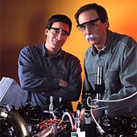 NIST physicists Dietrich Leibfried and David Wineland in the laboratory where they have developed a method for correcting data handling errors for quantum computing.
<P>
©Geoffrey Wheeler
