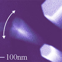 Electron micrograph of a NIST-grown nanowire with a high 'quality factor' vibrating more than 1 million times per second. At lower right, a stationary nanowire shows the typical hexagonal shape of the gallium nitride structures.<br /><br />Credit: S. Tanner, CU/JILA