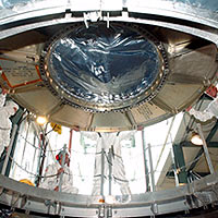 The Space Infrared Telescope Facility is lowered into the opening of the mobile service tower on Launch Pad 17-B, Cape Canaveral Air Force Station.
<P>
Image: NASA