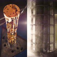 <p>
	Left: A view from below of the experimental probe, with the vacuum can removed. The STM head can be seen in white at the bottom while the rest of the device is effectively a refrigerator used to push the temperature down close to absolute zero. Right: The sealed probe, which includes the STM head and other refrigeration. It is iced over in the picture because this is just as we have removed it from a bath of Liquid helium (at 4Kelvin). Courtesy: M. Hamidian</p>
