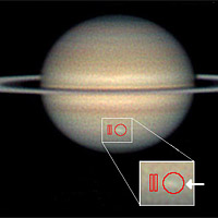 <p>Amateur astronomer Christopher Go took this image of the storm on March 13, 2010. The arrow indicates the location of the storm and the red outlines show where Cassini's composite infrared spectrometer gathered data.</p>
<p>Image credit: C.Go and NASA/JPL-Caltech/GSFC</p>