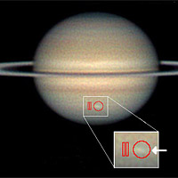 <p>Amateur astronomer Christopher Go took this image of the storm on March 13, 2010. The arrow indicates the location of the storm and the red outlines show where Cassini's composite infrared spectrometer gathered data.</p>
<p>Image credit: C.Go and NASA/JPL-Caltech/GSFC</p>