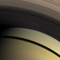 This natural color view from the Cassini spacecraft highlights the myriad gradations in the transparency of Saturn's inner rings. <br /><br />The dark shadows of the rings separate Saturn's southern hemisphere in the bottom of the image from the north. The innermost D ring is invisible, laid over the planet's northern hemisphere. The translucent C ring runs through the middle of the image. The denser B ring stretches across the top of the image. <br /><br />This view looks toward the sunlit side of the rings from about 48 degrees below the ringplane. Images taken using red, green and blue spectral filters were combined to create this natural color view. The images were acquired with the Cassini spacecraft wide-angle camera on Feb. 28, 2009 at a distance of approximately 1 million kilometers (620,000 miles) from Saturn. Image scale is 59 kilometers (37 miles) per pixel. <br /><br />Image Credit: NASA/JPL/Space Science Institute