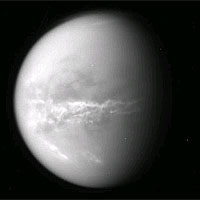 <p>
	NASA's Cassini spacecraft obtained this raw image of Saturn's moon Titan on Oct. 18, 2010. Bright clouds streak the moon's midsection, likely an indication of changing seasons and the arrival of spring in the northern hemisphere. Cassini's imaging camera was about 2.5 million kilometers (1.5 million miles) away from Titan. The rings of Saturn faintly etch the left side of this image. The image has not been validated or calibrated.</p>
<p>
	Image credit: NASA/JPL/SSI</p>
