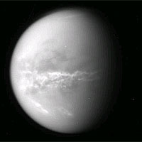 <p>
	NASA's Cassini spacecraft obtained this raw image of Saturn's moon Titan on Oct. 18, 2010. Bright clouds streak the moon's midsection, likely an indication of changing seasons and the arrival of spring in the northern hemisphere. Cassini's imaging camera was about 2.5 million kilometers (1.5 million miles) away from Titan. The rings of Saturn faintly etch the left side of this image. The image has not been validated or calibrated.</p>
<p>
	Image credit: NASA/JPL/SSI</p>
