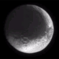The moon with the split personality, Iapetus, presents a puzzling appearance. One hemisphere of the moon is very dark, while the other is very bright. Whether the moon is being coated by foreign material or being resurfaced by material from within is not yet known. 
<P>
Iapetus' diameter is about one third that of our own moon at 1,436 kilometers (892 miles). The latest image was taken in visible light with the Cassini spacecraft narrow angle camera on July 3, 2004, from a distance of 3 million kilometers (1.8 million miles) from Iapetus (pronounced eye-APP-eh-tuss). 
<P>
The brightness variations in this image are not due to shadowing, they are real. The face of Iapetus visible was observed at a Sun-Iapetus-spacecraft, or phase, angle of about 10 degrees. The image scale is 18 kilometers (11 miles) per pixel. The image was magnified by a factor of two to aid visibility. 
<P>
The Cassini-Huygens mission is a cooperative project of NASA, the European Space Agency and the Italian Space Agency. The Jet Propulsion Laboratory, a division of the California Institute of Technology in Pasadena, manages the Cassini-Huygens mission for NASA's Office of Space Science, Washington, D.C. The Cassini orbiter and its two onboard cameras were designed, developed and assembled at JPL. The imaging team is based at the Space Science Institute, Boulder, Colo. 
<P>
For more information, about the Cassini-Huygens mission visit, <A HREF='http://saturn.jpl.nasa.go' TARGET='_blank'>http://saturn.jpl.nasa.go</A>v and the Cassini imaging team home page, <A HREF='http://ciclops.or' TARGET='_blank'>http://ciclops.or</A>g. 
<P>
Credit: NASA/JPL/Space Science Institute
