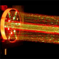 <p>
	Shooting Lasers</p>
<p>
	This picture shows a lab demonstration of the measurement chamber inside the Tunable Laser Spectrometer, an instrument that is part of the Sample Analysis at Mars investigation on NASA's Curiosity rover. This demonstration uses visible lasers -- rather than the infrared ones on the actual spectrometer -- to show how the lasers bounce between the mirrors in the measurement chamber.</p>
<p>
	The TLS shoots laser beams into a type of measurement chamber that can be filled with Mars air. By measuring the absorption of light at specific wavelengths, the tool can measure concentrations of methane, carbon dioxide and water vapor in the Martian atmosphere and different isotopes of those gases.</p>
<p>
	Researchers are using Curiosity's 10 instruments to investigate whether areas in Gale Crater ever offered environmental conditions favorable for microbial life. JPL, a division of the California Institute of Technology in Pasadena, manages the project for NASA's Science Mission Directorate, Washington, and built Curiosity. The SAM instrument was developed at Goddard with instrument contributions from Goddard, JPL and the University of Paris in France.</p>
