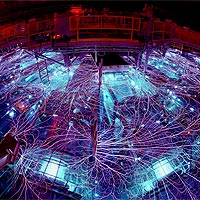 Sandia's Z machine firing. The 'arcs and sparks' formed at the water-air interface travel between metal conductors. (Photo by Randy Montoya)