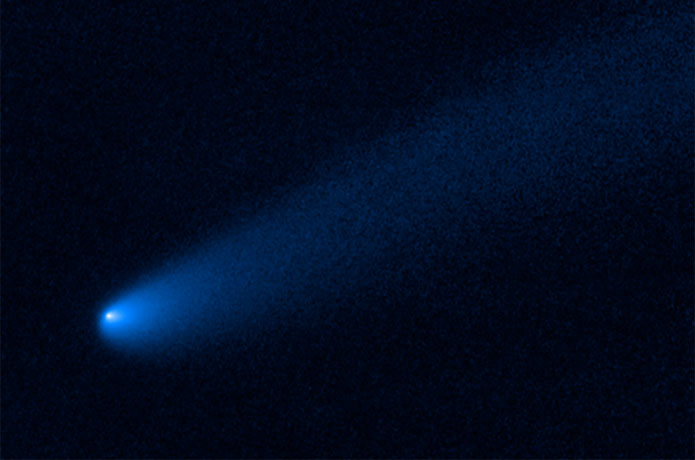 <p>Astronomers found a roaming comet taking a rest stop before possibly continuing its journey. The wayward object made a temporary stop near giant Jupiter. The icy visitor has plenty of company. It has settled near the family of captured asteroids known as Trojans that are co-orbiting the Sun alongside Jupiter. This is the first time a comet-like object has been spotted near the Trojan asteroid population. Hubble Space Telescope observations reveal the vagabond is showing signs of transitioning from a frigid asteroid-like body to an active comet, sprouting a long tail, outgassing jets of material, and enshrouding itself in a coma of dust and gas.</p>

<p>Credits: NASA, ESA, and B. Bolin (Caltech)</p>
