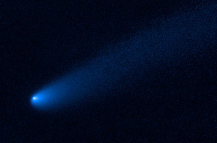 <p>Astronomers found a roaming comet taking a rest stop before possibly continuing its journey. The wayward object made a temporary stop near giant Jupiter. The icy visitor has plenty of company. It has settled near the family of captured asteroids known as Trojans that are co-orbiting the Sun alongside Jupiter. This is the first time a comet-like object has been spotted near the Trojan asteroid population. Hubble Space Telescope observations reveal the vagabond is showing signs of transitioning from a frigid asteroid-like body to an active comet, sprouting a long tail, outgassing jets of material, and enshrouding itself in a coma of dust and gas.</p>

<p>Credits: NASA, ESA, and B. Bolin (Caltech)</p>
