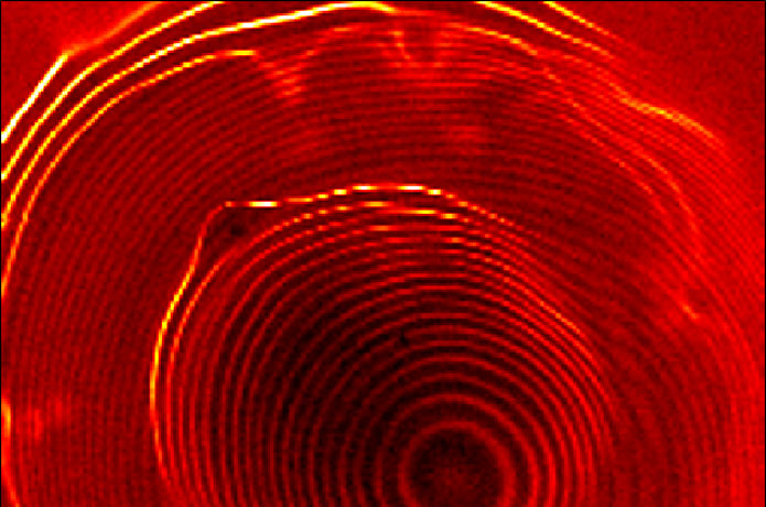 <p>Image of a novel system of coupled quantum dots taken with a scanning tunneling microscope shows electrons orbiting within two concentric sets of closely spaced rings, separated by a gap. The inner set of rings represents one quantum dot; the outer, brighter set represents a larger, outer quantum dot.</p>

<p>Credit: NIST</p>
