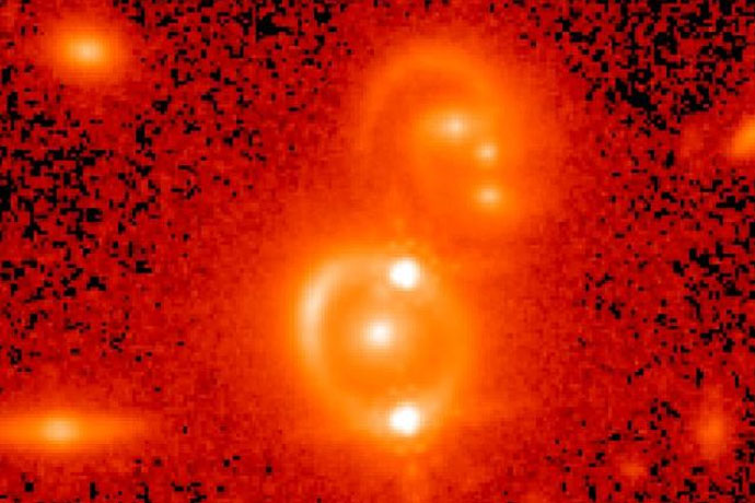 <p>A Hubble Space Telescope picture of a doubly imaged quasar.</p>

<p>NASA Hubble Space Telescope, Tommaso Treu/UCLA, and Birrer et al</p>

<p> </p>
