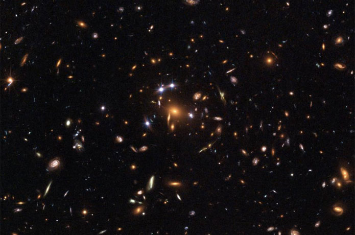 <p>This image from the Hubble Space Telescope shows lensing of distant galaxies by gravity. UC Davis astronomers are using this phenomenon to learn more about the properties of dark matter.</p>

<p>Image courtesy: UC Davis</p>
