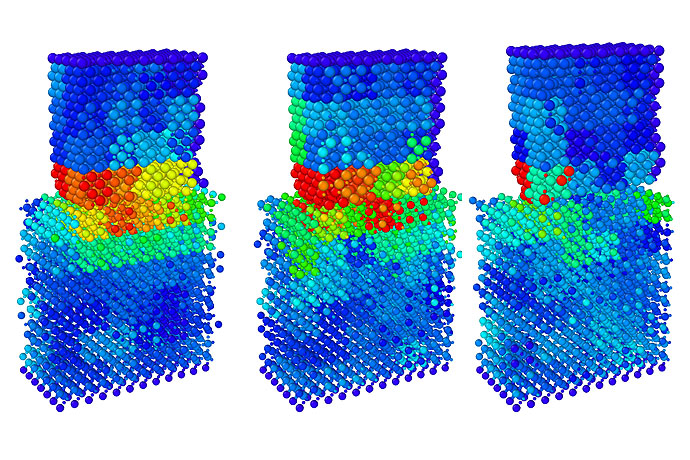 <p>These images show how the surfaces of magnesia (top block) and barium titanate (bottom block) respond when they come into contact with each other. The resulting lattice deformations in each object contributes to the driving force behind the electric charge transfer during friction. Contact goes from right to left. Credit: James Chen, University at Buffalo.</p>
