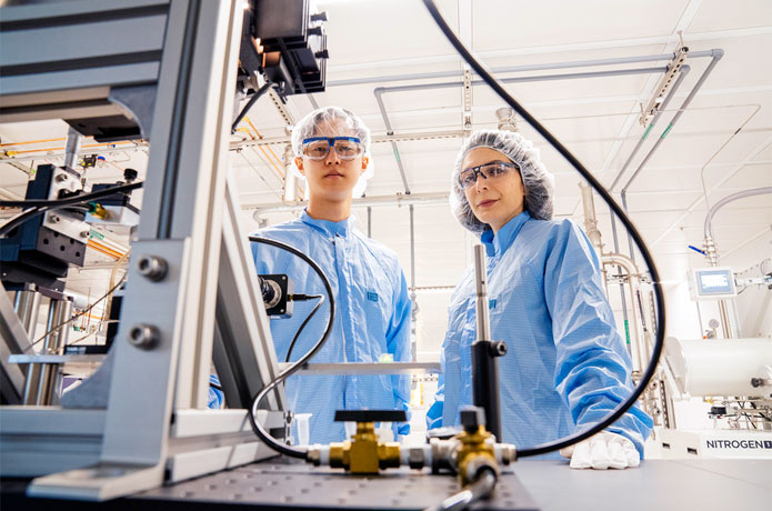 <p>Farnaz Niroui (right) and graduate student Spencer Zhu in their lab in a cleanroom at the MIT.nano building. Photo: M. Scott Brauer</p>
