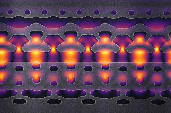 <p>This image, magnified 25,000 times, shows a section of an accelerator-on-a-chip. The gray structures focus infrared laser light (shown in yellow and purple) on electrons flowing through the center channel. By packing 1,000 channels onto an inch-sized chip, Stanford researchers hope to accelerate electrons to 94 percent of the speed of light. (Image credit: Courtesy Neil Sapra)</p>
